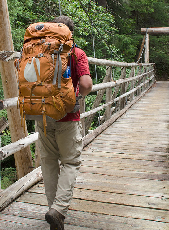backpacker heading into the woods